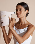 Side view of a model using the Solaine Pro LED face mask, highlighting its comfortable fit and rejuvenating LED technology