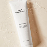 Display of key ingredients, including goat milk and organic cranberry extract, highlighting their skin benefits.