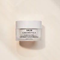 Display of key ingredients, including pumpkin enzymes and glycolic acid, highlighting their exfoliating benefits.