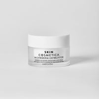 Skin Cosmetica Microderm Exfoliator jar showcasing the cream-based formula enriched with glycolic and bilberry extracts.