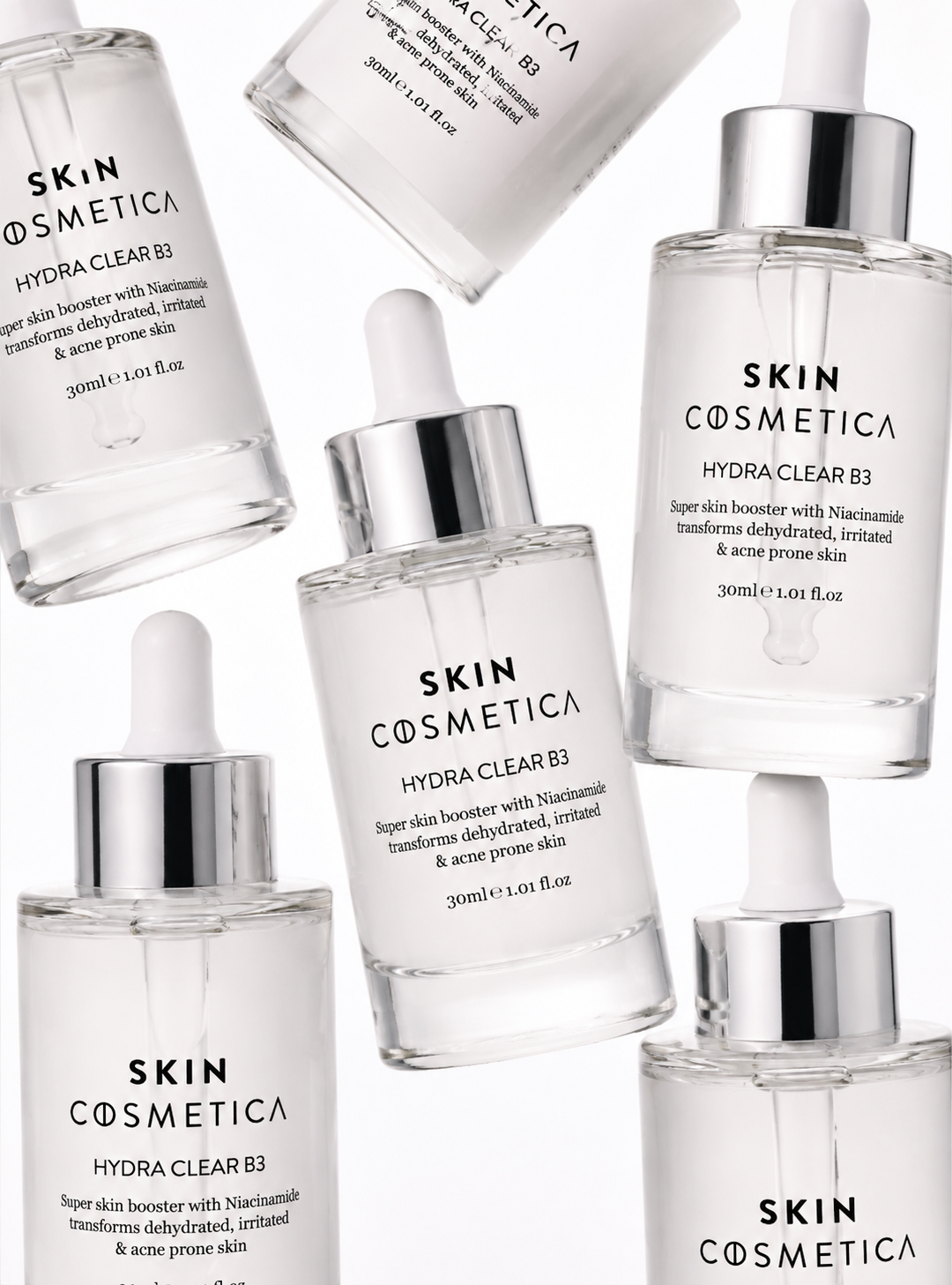 Multiple Skin Cosmetica Hydra Clear B3 serum bottles arranged in a luxury flat lay composition, showcasing a hydrating niacinamide serum for clear, balanced and healthy-looking skin.