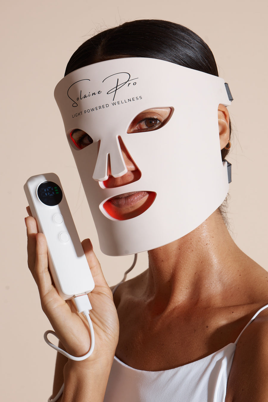 Model wearing the Solaine Pro LED face mask, showcasing its effective skin therapy design and glowing light features.