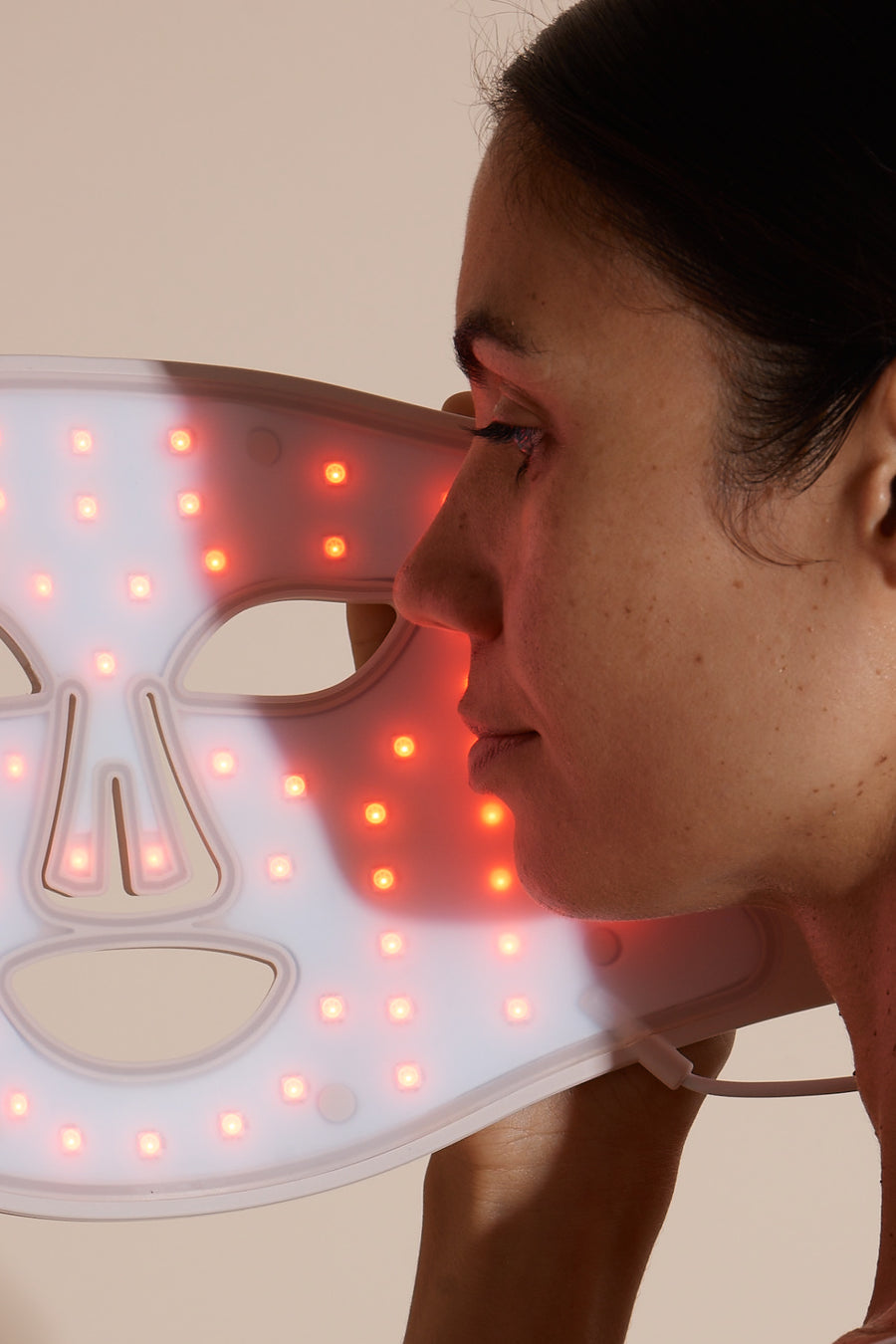 Solaine Pro LED face mask showcasing red light therapy in use, promoting skin rejuvenation and reducing the appearance of fine lines