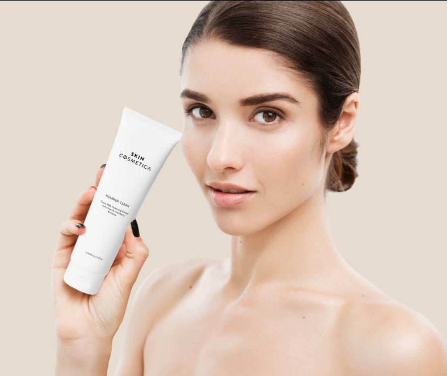 Close-up of Nourish Clean Cleansing Cream to damp skin, illustrating its creamy consistency.