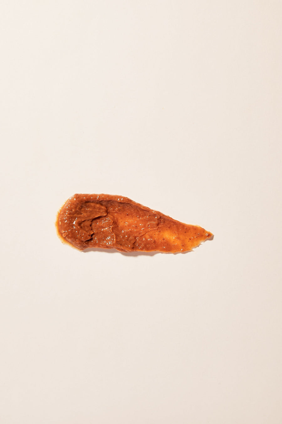 Close-up of Pumpkin Peel Exfoliator, illustrating its rich formula.