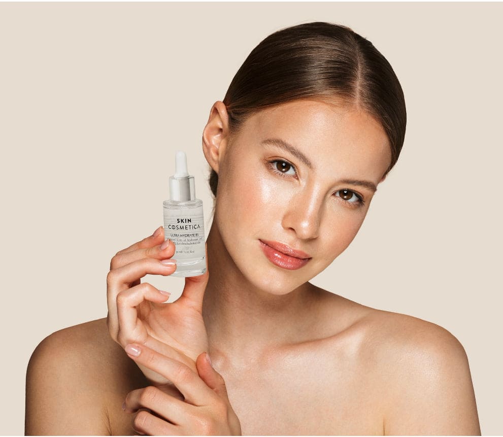 Pure Hyaluronic Acid Serum to damp skin, illustrating its lightweight texture.
