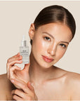 Pure Hyaluronic Acid Serum to damp skin, illustrating its lightweight texture.