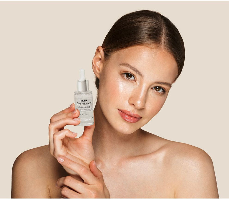 Pure Hyaluronic Acid Serum to damp skin, illustrating its lightweight texture.