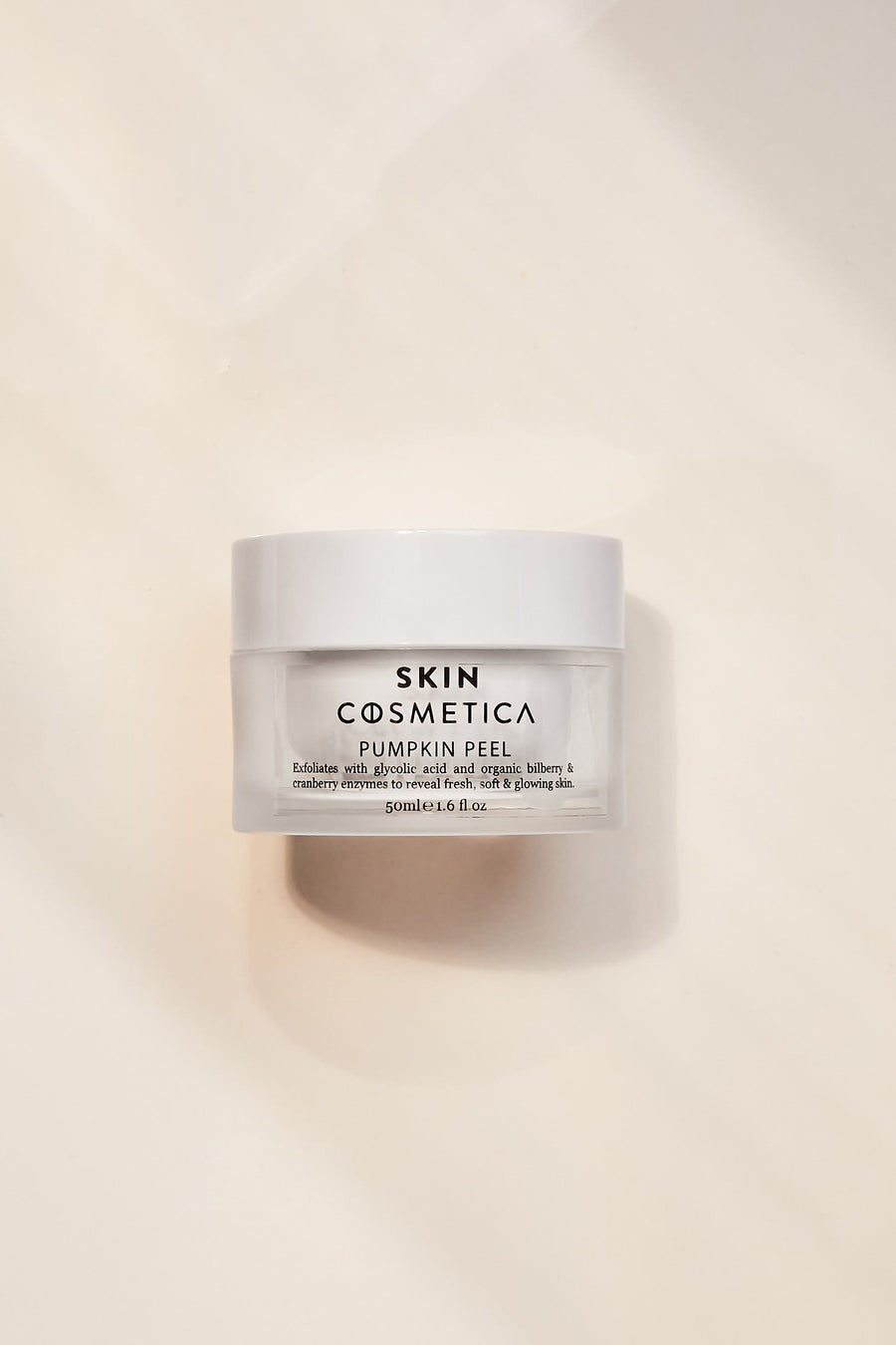 Display of key ingredients, including pumpkin enzymes and glycolic acid, highlighting their exfoliating benefits.